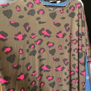 Boutique blouse with lots of stretch. Not clingy.